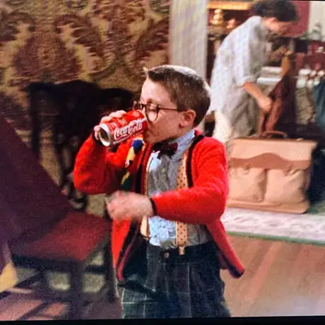 home alone scene of kid drinking coke from a can