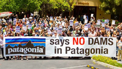 crowd protesting with banner that says Patagonia says no dams in Patagonia